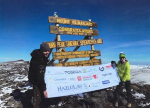 Posera at the top of Kilimanjaro mountain blog post